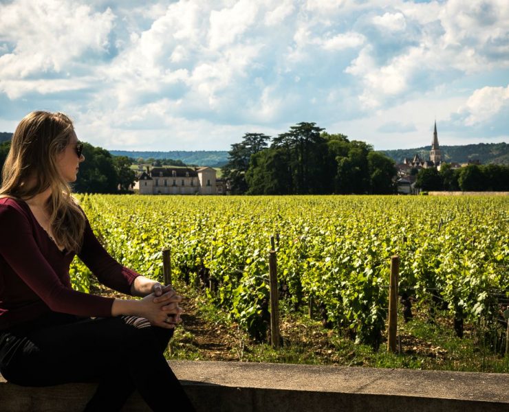 woman looking at vineyard in france