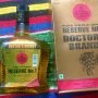 A bottle and box of Doctor's Brandy, labeled "Pure V.S.O.P. Grape Reserve No.1." The bottle is on a colorful striped background.